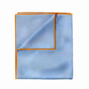 A blue microfibre cloth with a yellow border on a white background