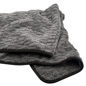 grey textured microfibre drying towel on a white background
