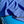 A dark blue waffle weave microfibre drying towel spread over a car bonnet