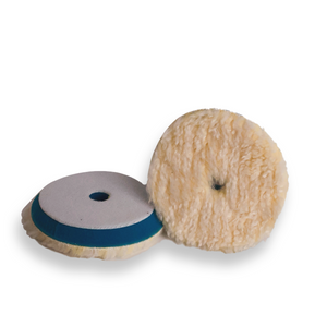 Dual-sided wool buffing pad with a tan colour on the surface and a blue backing foam visible in one side.