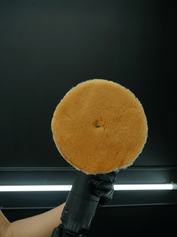 wool polishing pad on a black background
