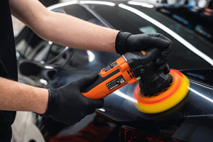 Detailer Using ADBL Roller D9/125 Dual Action Polisher on Black Car Paint - Machine Polishing for Swirl Removal