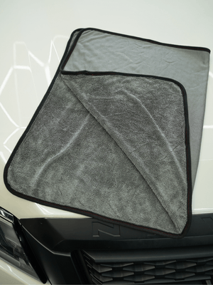 Grey car drying towel on a car bonnet
