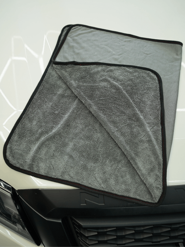 Grey car drying towel on a car bonnet