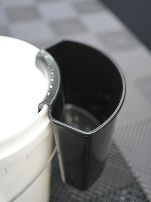 Car wash tool holder on a white bucket 