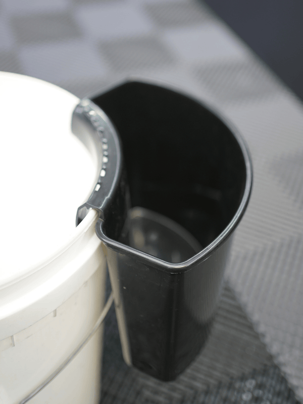Car wash tool holder on a white bucket 