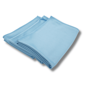 A stack of blue glass cloths on a white background