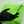 A person cleaning a white car with a green microfibre cloth and black glove on