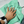 A person holding a green microfibre cloth on a white car