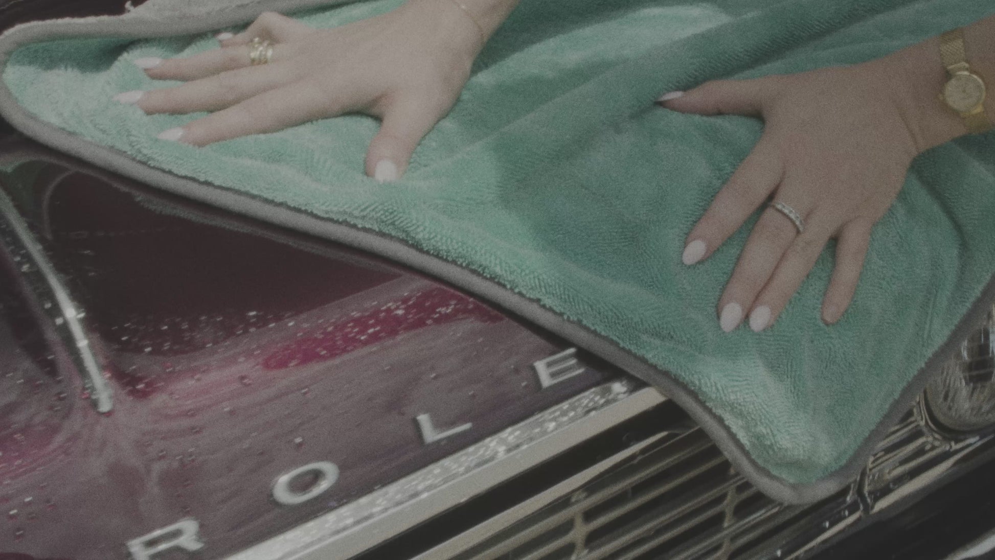 Aqua and grey drying towel in use 